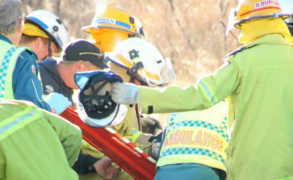 Emergency teams attempt to stabilise the trapped female student driver. Emergency teams attempt to stabilise the trapped female student driver.